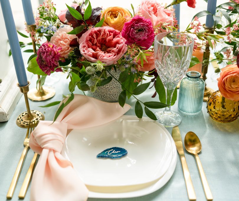 Pink and blue floral wedding place setting