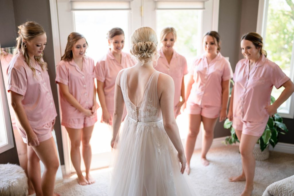 Bride first look with bridesmaids by lake of the Ozarks wedding photographer Mitchell Bennett Photography
