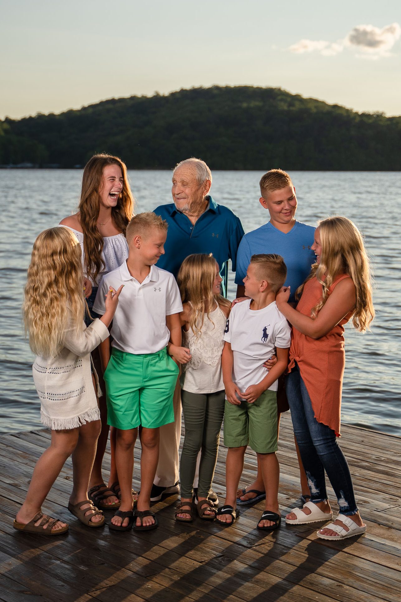 grandpa laughing with grandkids at the lake of the Ozarks professional photographer