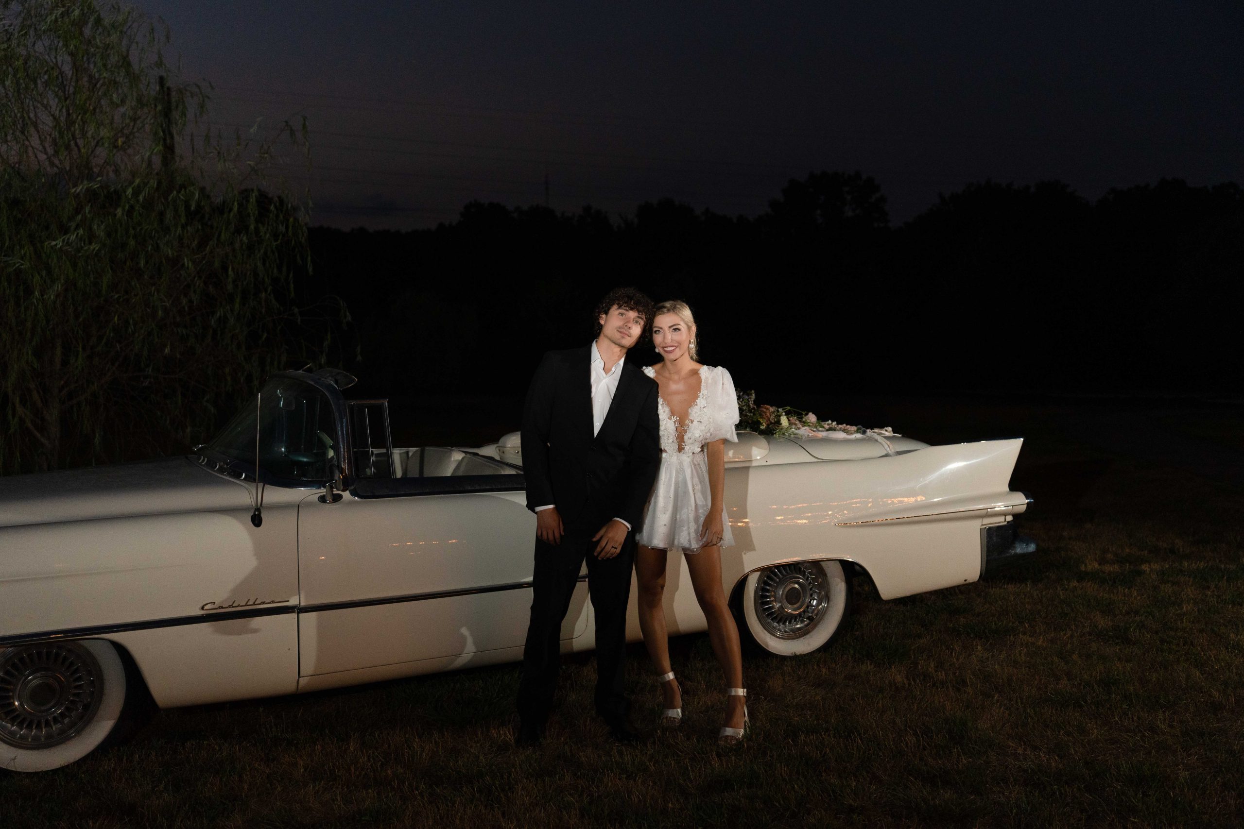 wedding couple photo with classic car at night