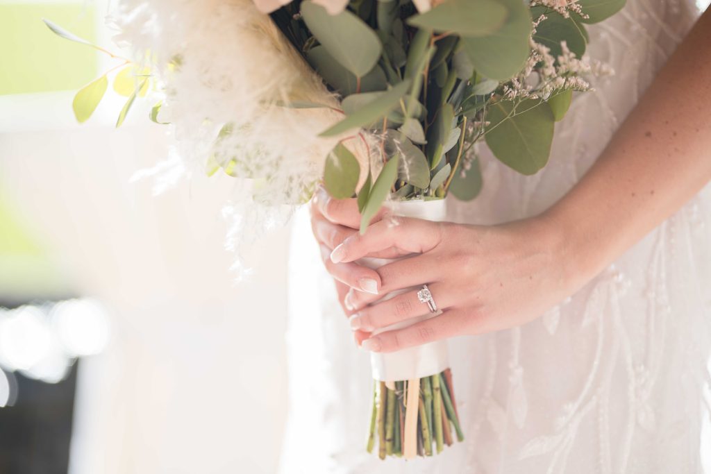 Bride holding bouquet by Lake of the Ozarks Wedding Photographer Mitchell Bennett Photography