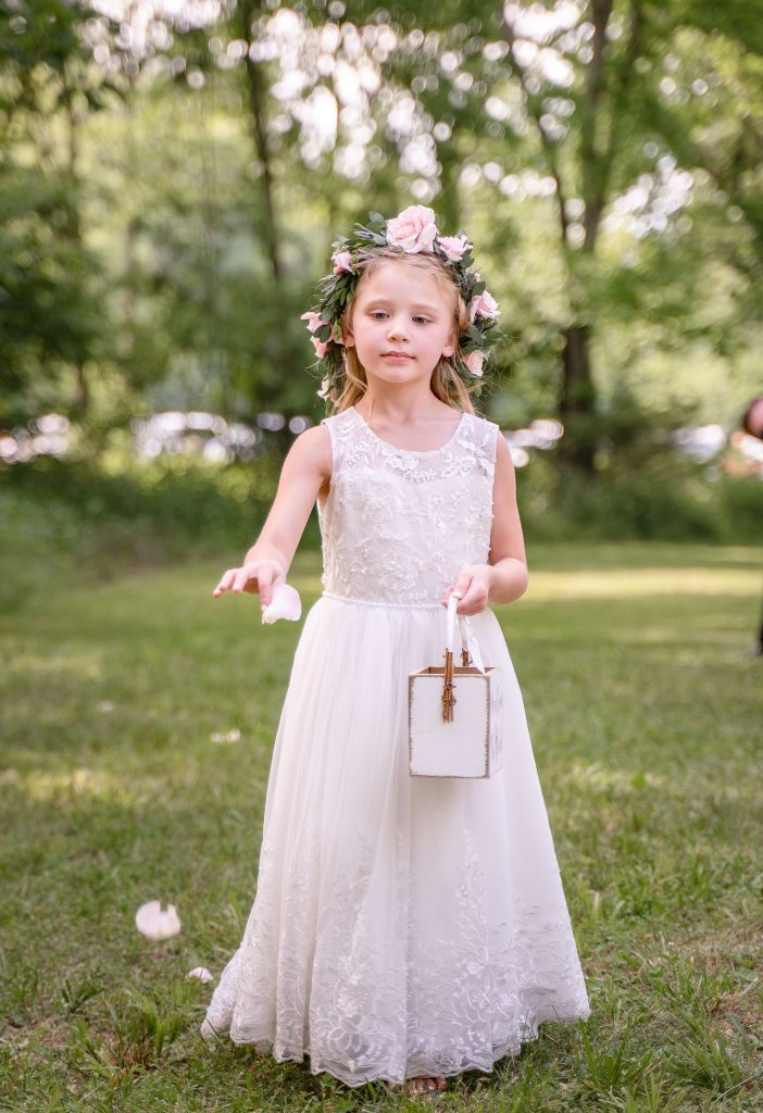 flower girl at Seven Springs Winery by lake of the Ozarks wedding photographer