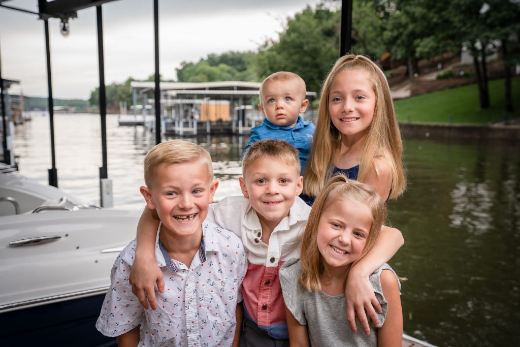 Kids on a dock by Lake of the Ozarks Family Photographer