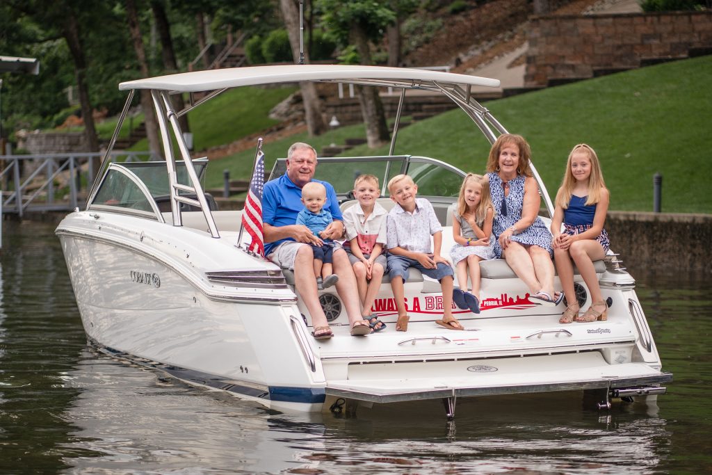 Family Photo on a boat by Lake of the Ozarks Photographer