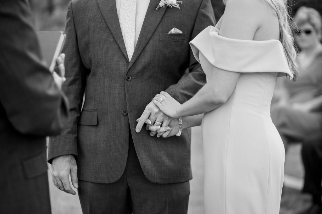 holding hands by lake of the Ozarks wedding photographer Mitchell Bennett Photography