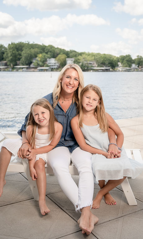 Family on a dock by Lake of the Ozarks Family Photographer
