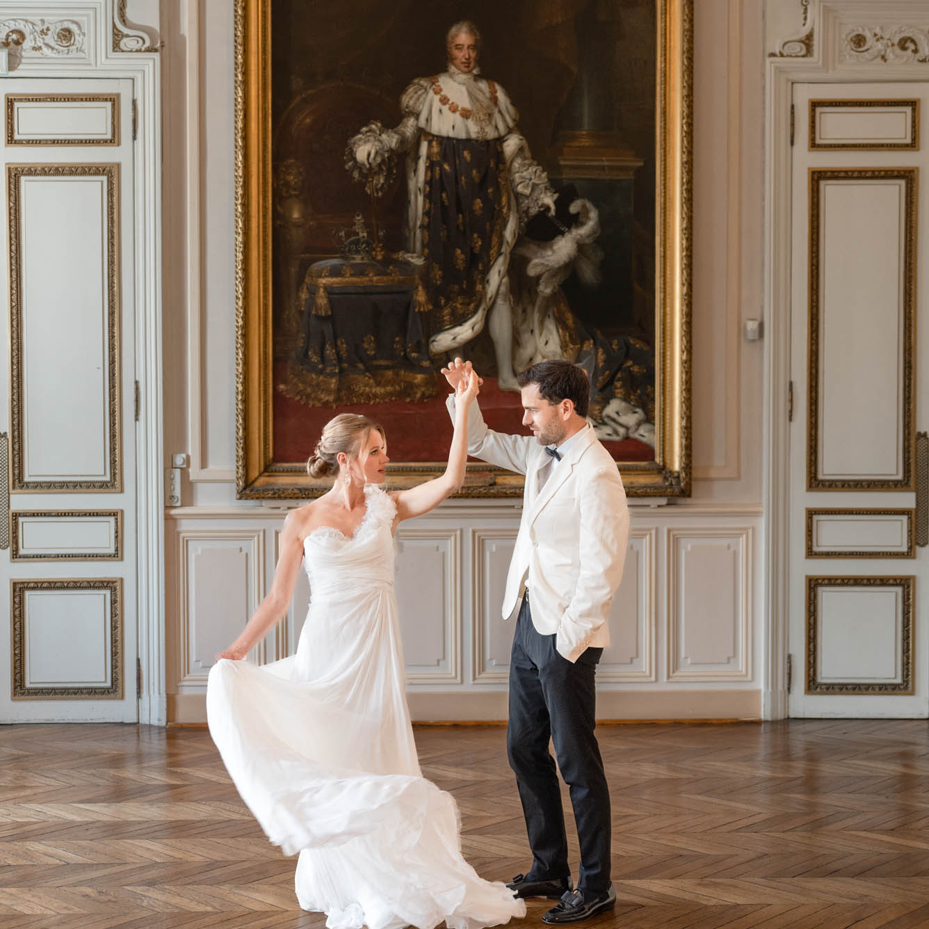 Paris wedding couple twirling by Mitchell Bennett Photography